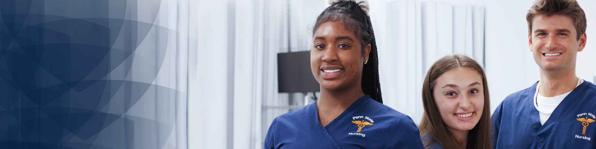 3 smiling nursing students in scrubs