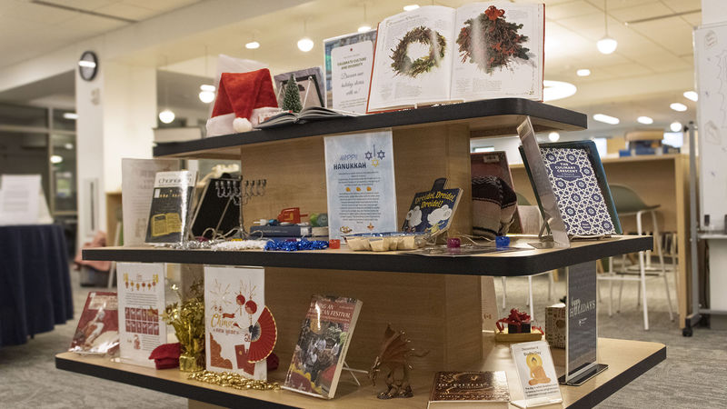 a collection of books, photos and items highlighting holiday traditions from around the world