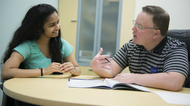 Jon Tobin, career services coordinator, meets with a student to discuss opportunities such as mentoring and internships that she can use to start building career experience while still in college.