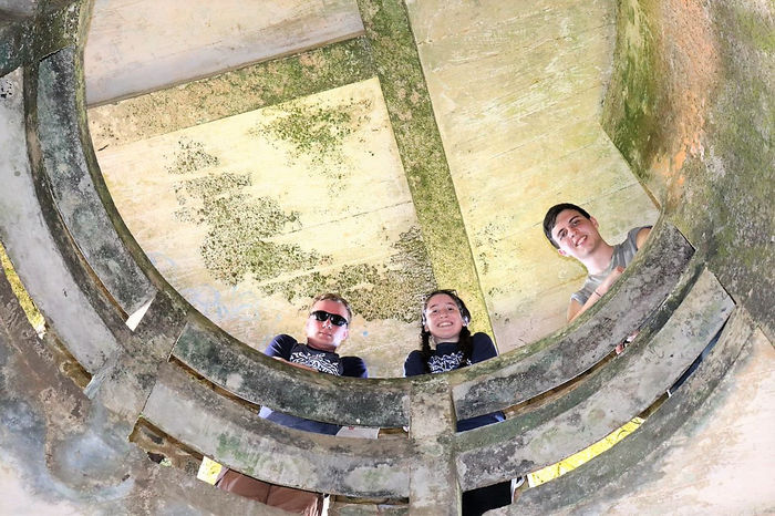 students look down from a bell tower they toured