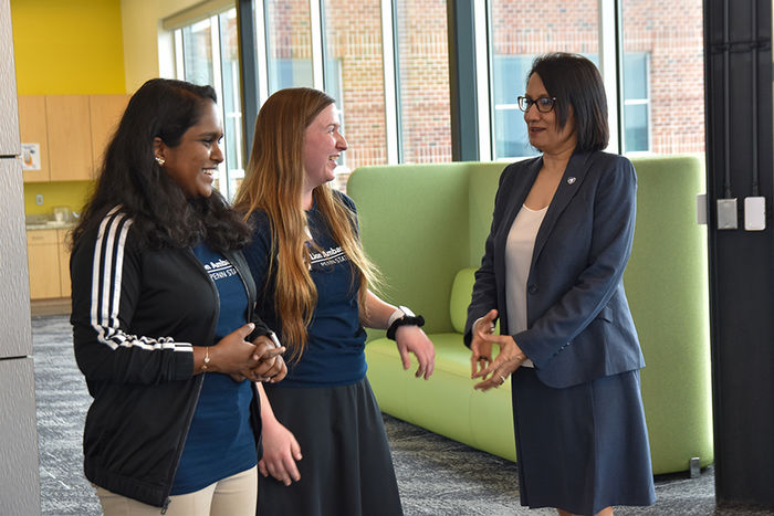 Two Lion Ambassadors speaking to Bendapudi