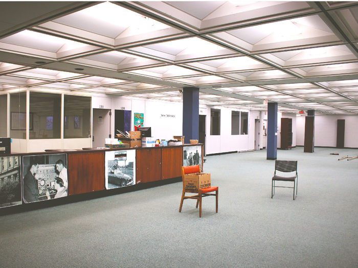 The main floor and circulation desk of the library now empty of all furniture and books