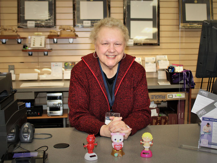 Evelyn Miller stands at the bookstore counter