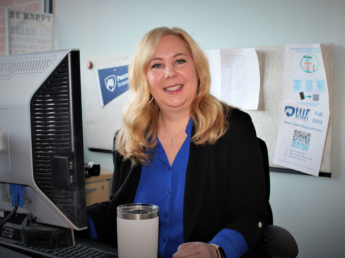 Megan Cruciani seated at her computer