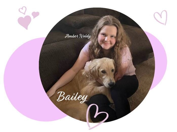 girl holding her golden retriever dog