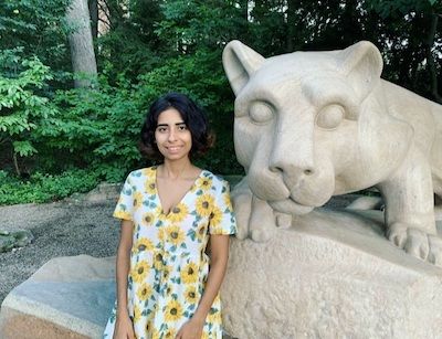 Photo of Harman Singh posing in front of Nittany Lion statue