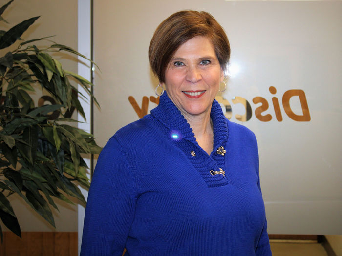 Terri Caputo standing in visitors area of admissions office