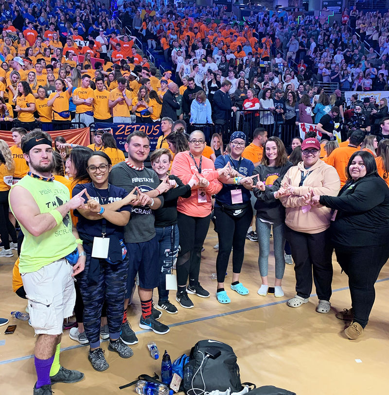 Scranton dancers pose for a photo with crowd in background