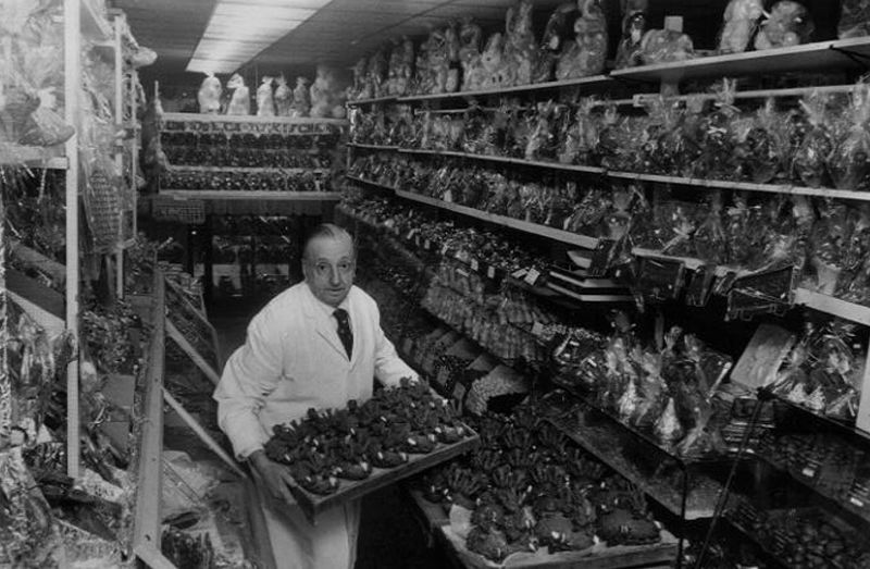 Dunmore candy kitchen original owner stocking shelves at Dunmore Candy Kitchen