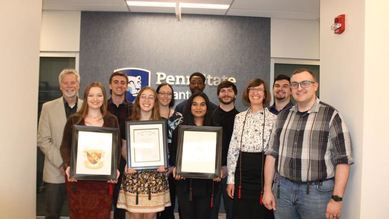 group of honor society inductees pose for a photo