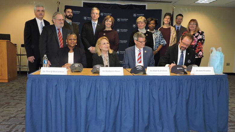 Administrators gather to sign articulation agreement