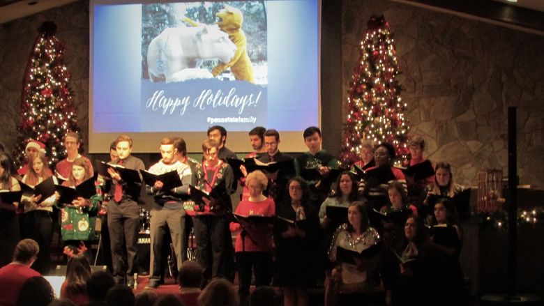 singers from the Scranton chorale dressed in holiday garb singing during the 2019 holiday concert