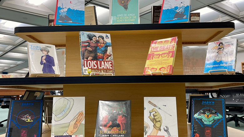 A tabletop display of manga and graphic novels