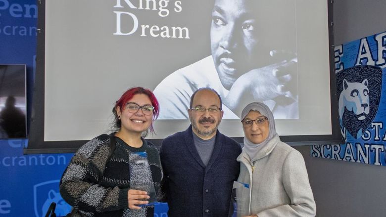 Diversity award winners pose for photo holding awards