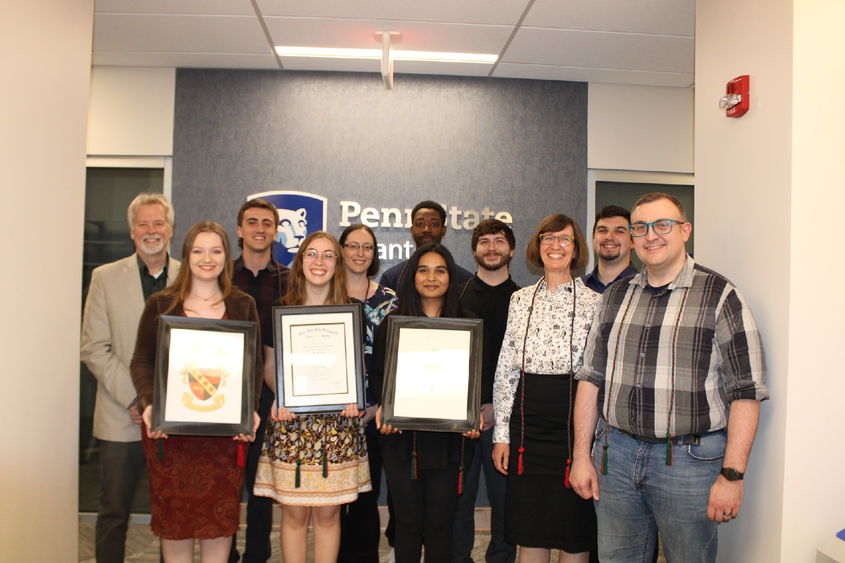 group of honor society inductees pose for a photo