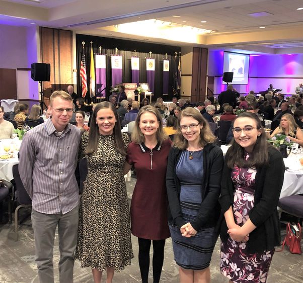 students posing with author Madeline Miller