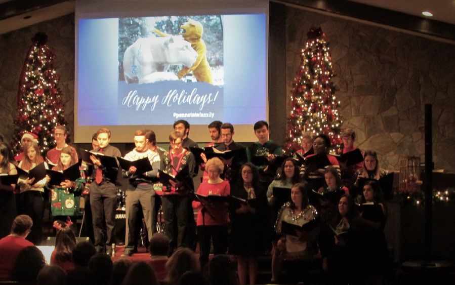 singers from the Scranton chorale dressed in holiday garb singing during the 2019 holiday concert