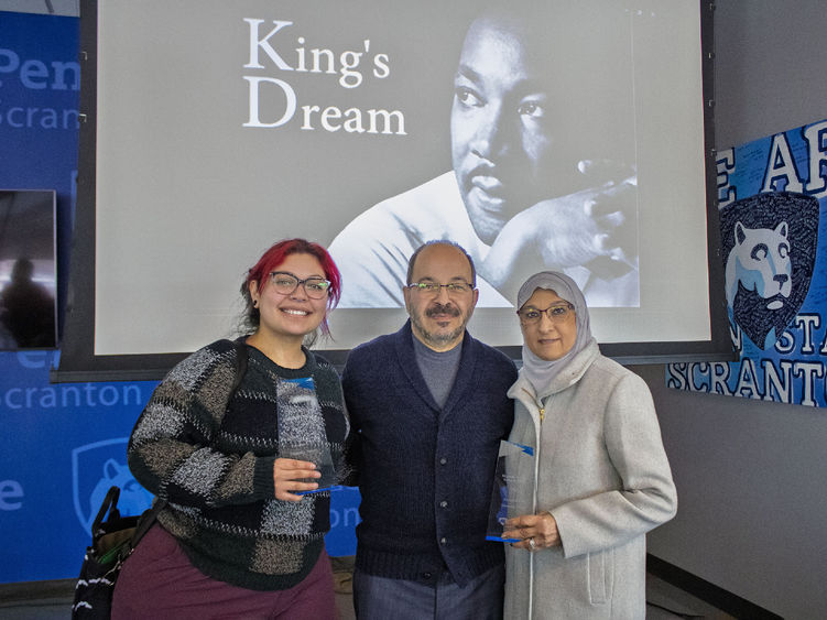 Diversity award winners pose for photo holding awards